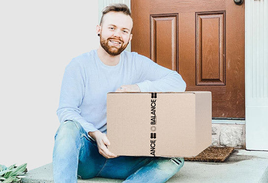 Man receiving his box of Balance meals